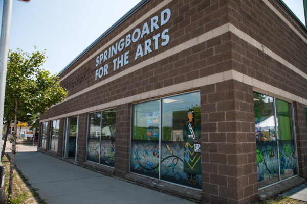 Springboard for the Arts exterior with art from Sarah Ageton Howes and Holly Young
