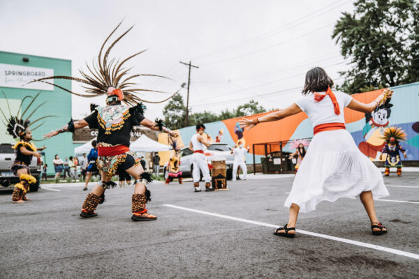 Mexica-Nahua dancers in a parking lot