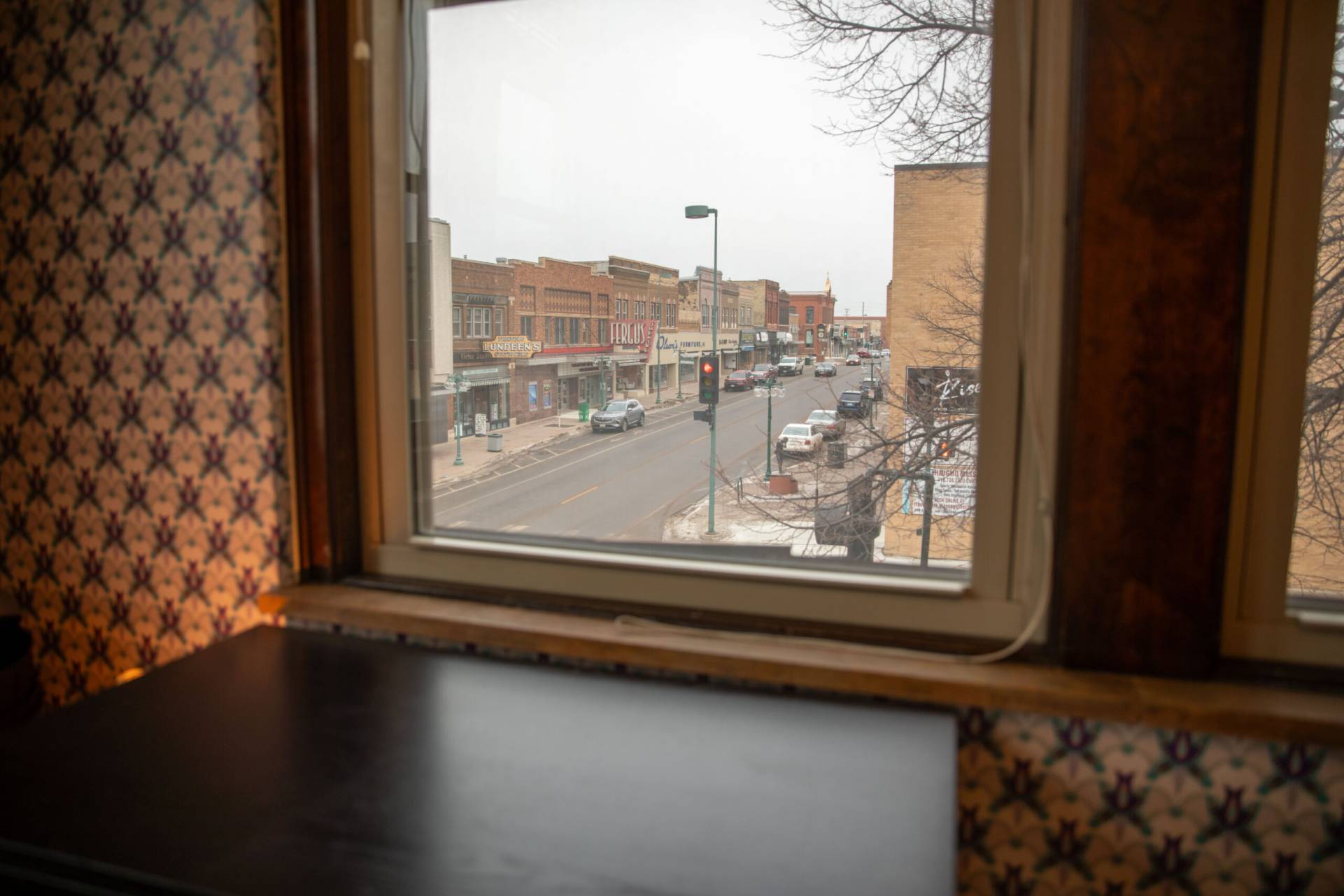 A photo of a corner view inside of an apartment overlooking main street in downtown Fergus Falls, Minnesota.